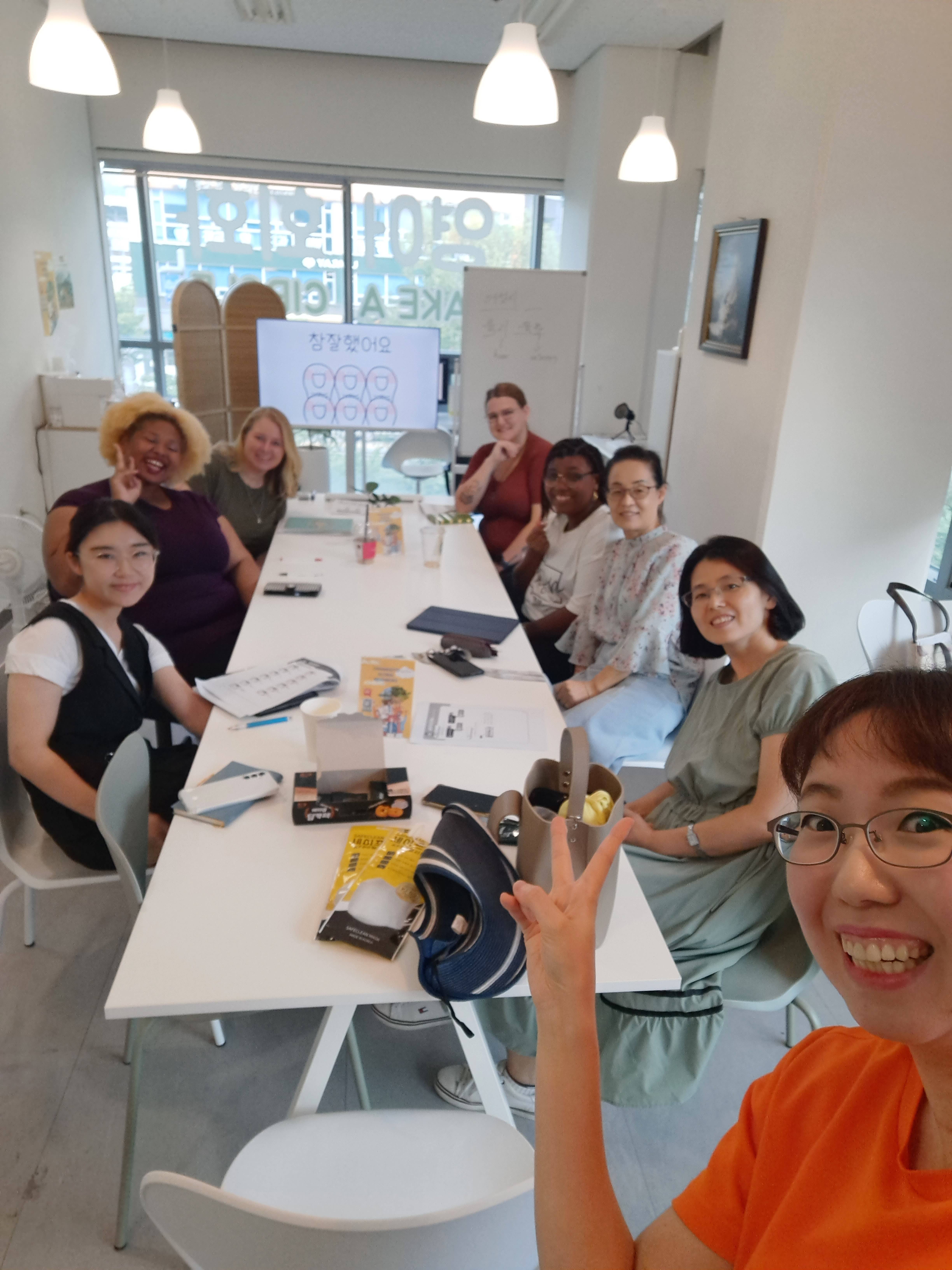 A diverse group of students learning Korean